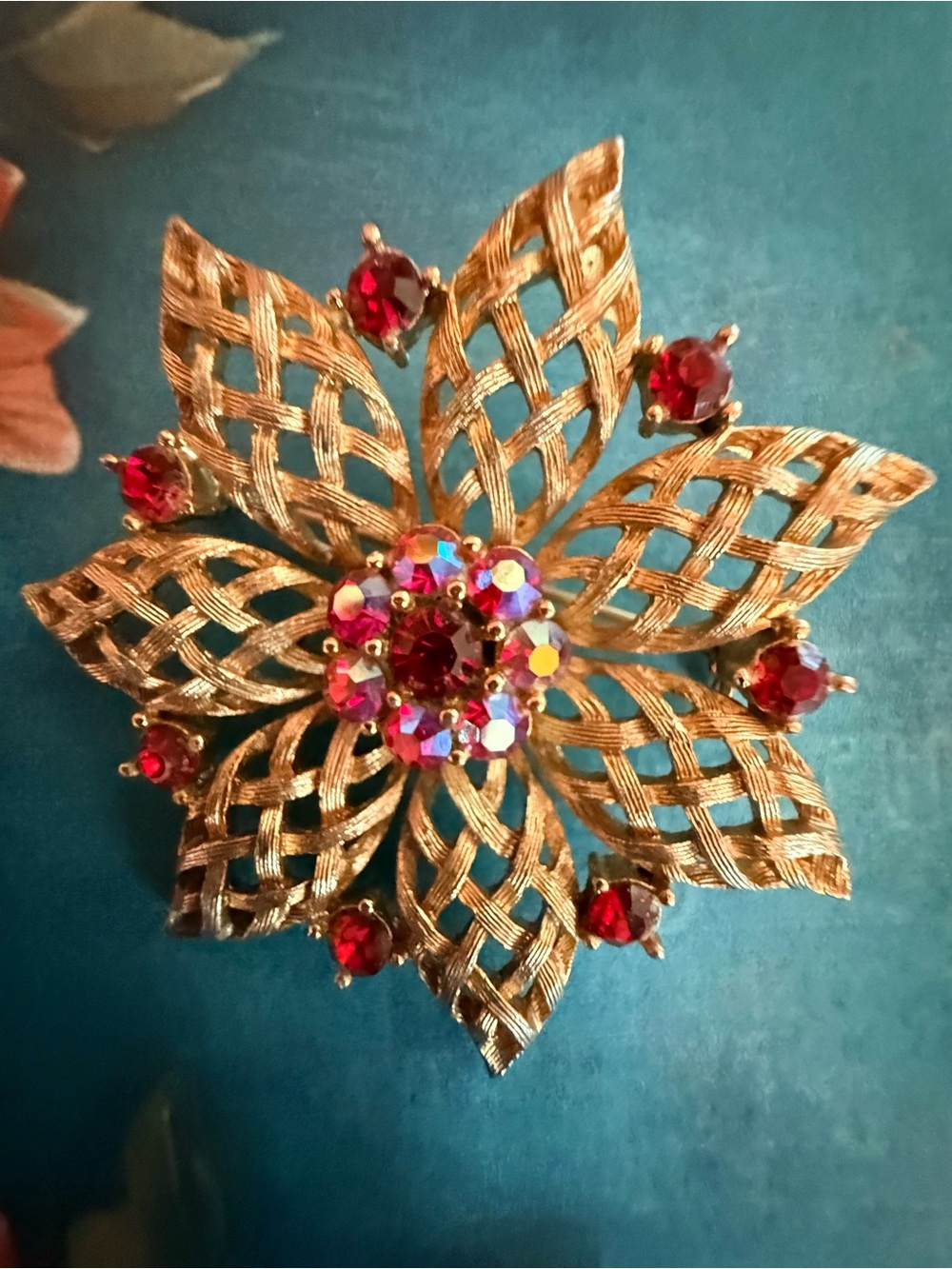 Gold-Tone Floral Brooch with Red Crystal Accents